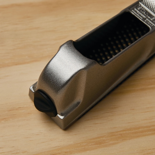 STANLEY 21-399 metal hand rasp tool on light wood surface, close-up angle.