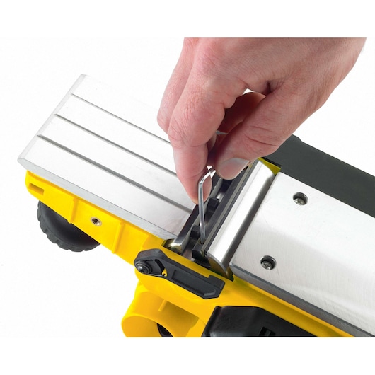 STANLEY STPP7502-B2 yellow planer showing blade adjustment from top angle
